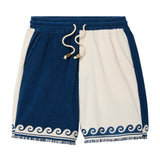Navy and white shorts with wave design on a white background
