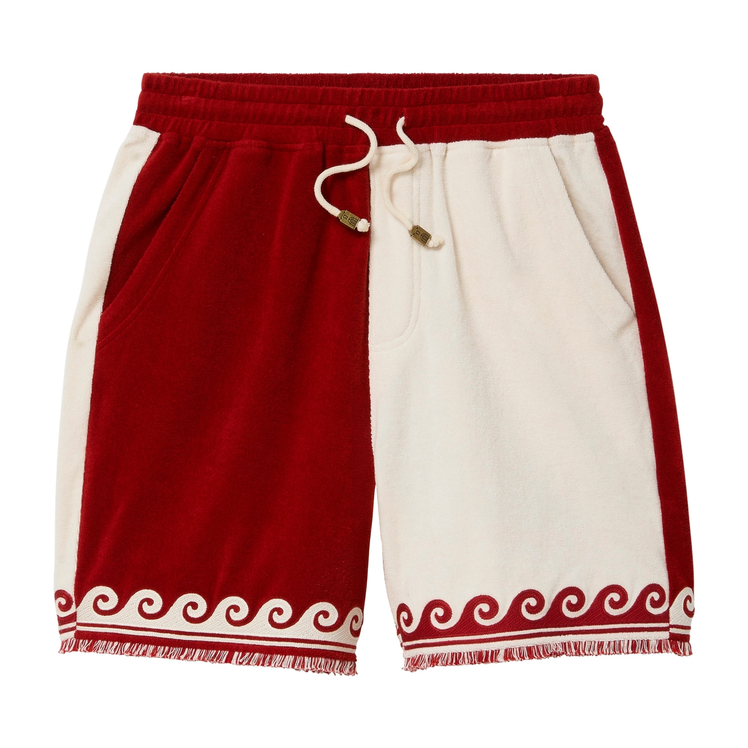 Red and white shorts with wave patterns across hem.