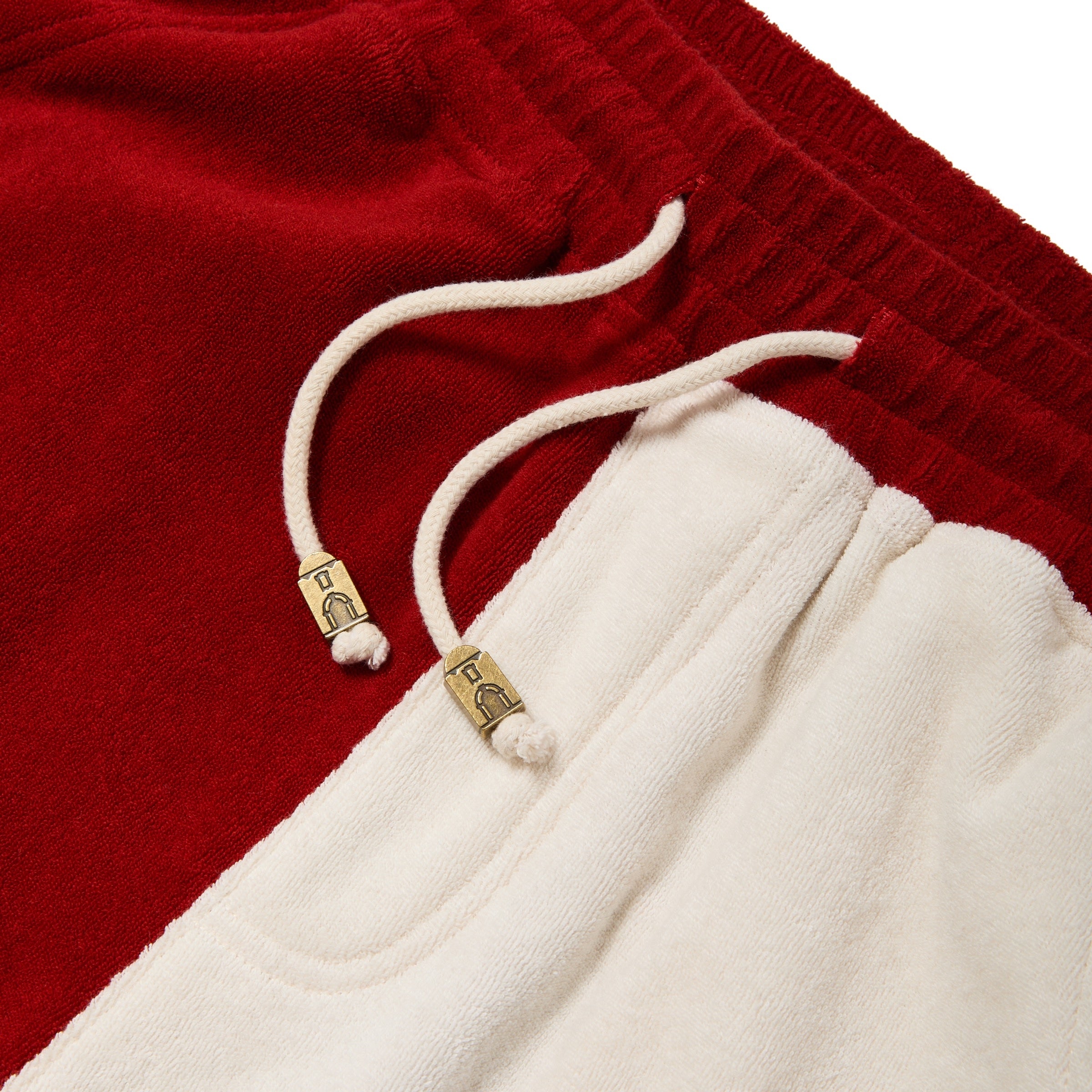 Close-up of drawstrings with mini hotel eyelet stoppers. 