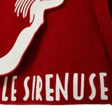 Red skirt with white embroidered design and text 'LE SIRENUSE'.