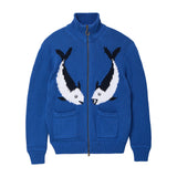 Blue zip-front knit sweater featuring two mirrored fish motifs and front patch pockets.