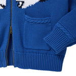 Close-up of blue knit zip-front sweater with ribbed hem, cuff, and front pocket.