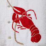 Red embroidered lobster on a white terry cloth background