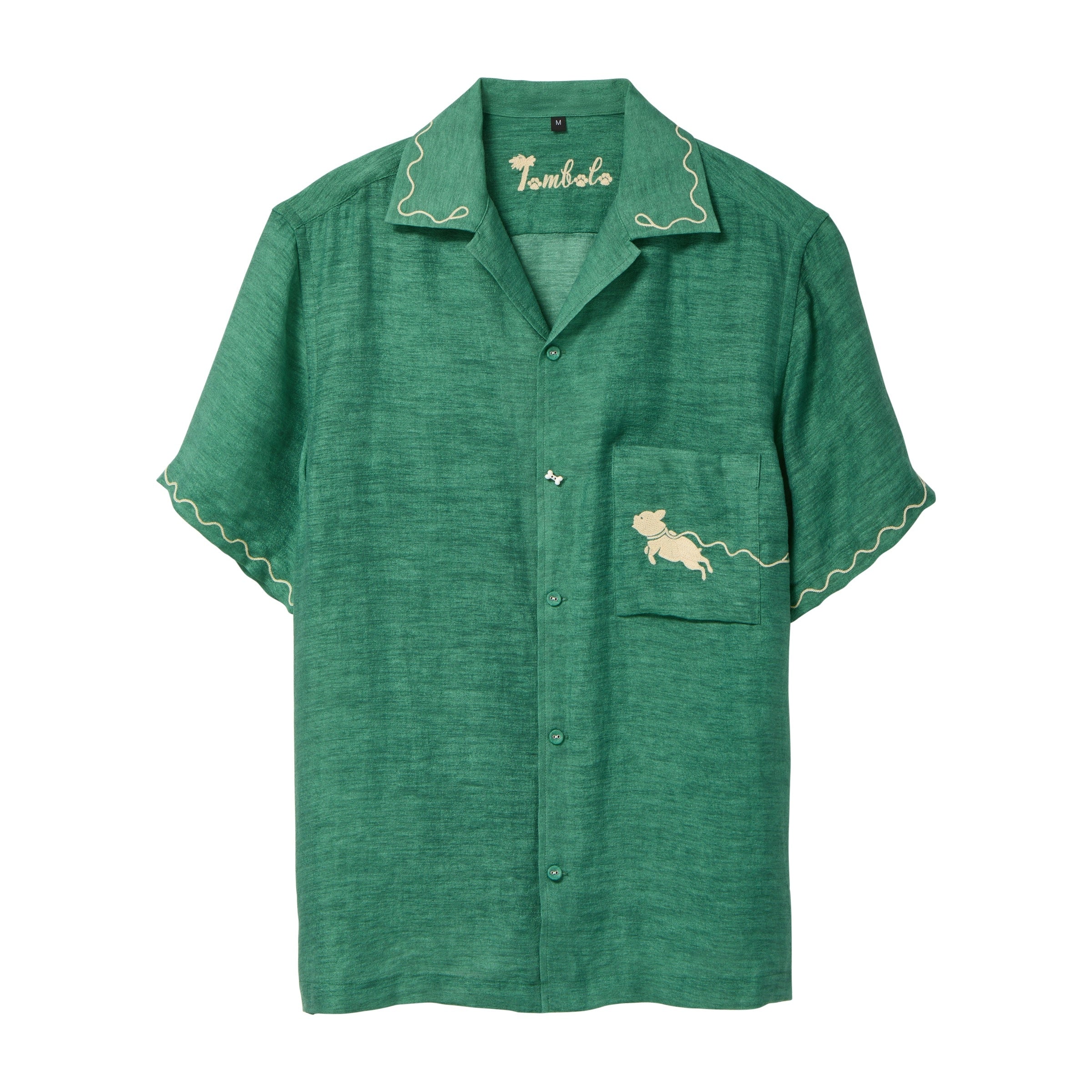 Green cabana shirt with contrast wavy piping along the collar and sleeves, chest pocket with embroidered dog graphic, and a dog bone button at the center front.