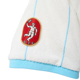 Cuff of Una Pizza Jersey with red pizza patch. 