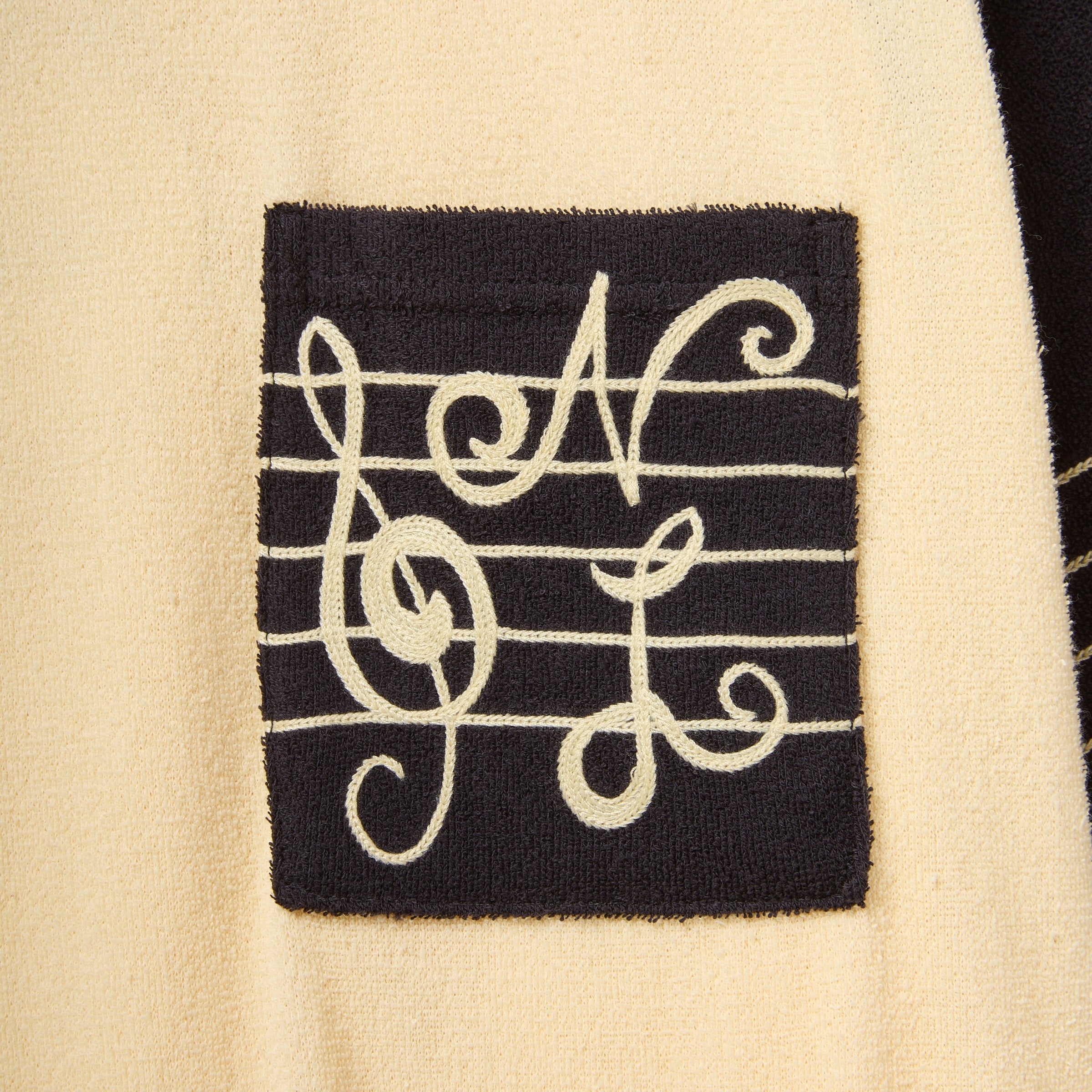 Front chest pocket with SNL musical logo embroidery.