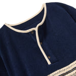 Navy blue garment with white trim on a white background