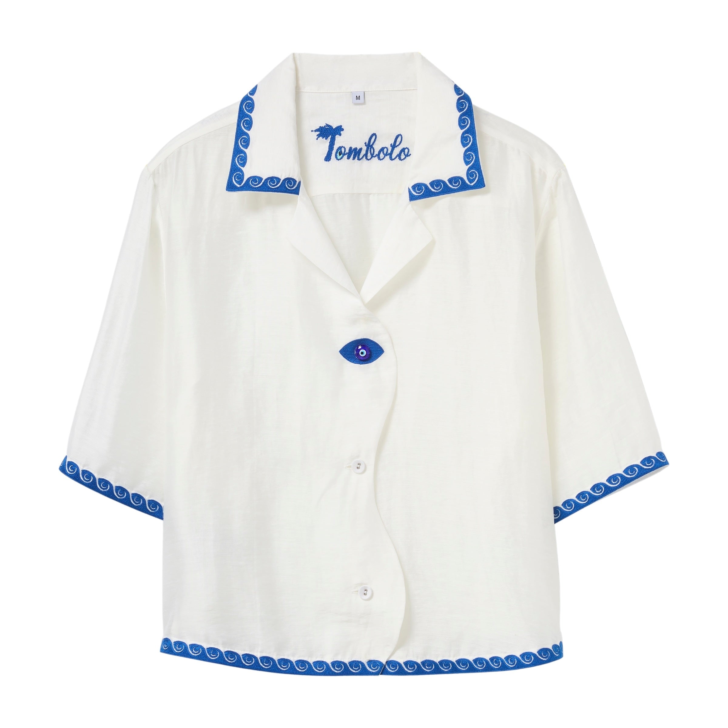 White shirt with blue trim and 'Tombolo' branding on a white background