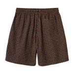 Brown and black checkered shorts on a white background