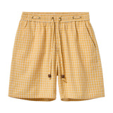Yellow checkered shorts on a white background