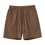 Brown checkered shorts on a white background