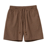 Brown checkered shorts on a white background