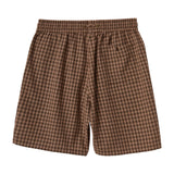 Brown checkered shorts on a white background