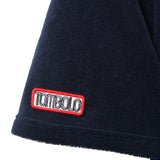 Navy blue terrycloth sleeve with a red and white 'Tombolo' logo patch.