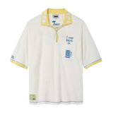 Cream terry cloth polo shirt with a yellow contrast collar, blue contrast stitching, embroidered “I was there in…” text, chest pocket with FIFA World Cup New York New Jersey patch, and FIFA World Cup sleeve patch.