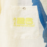 Close-up of a beige pocket with yellow text and logo on a garment, featuring 'FIFA New York New Jersey'.