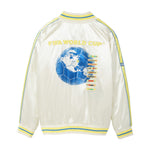 Back of a white satin bomber jacket with yellow and blue striped trim, yellow “FIFA World Cup™” embroidery, a large blue globe and soccer ball graphic, colorful embroidered destination tags, and striped shoulder details.
