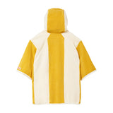 Back of yellow and white hooded poncho on a white background