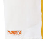White trunks with orange 'Tombolo' logo 