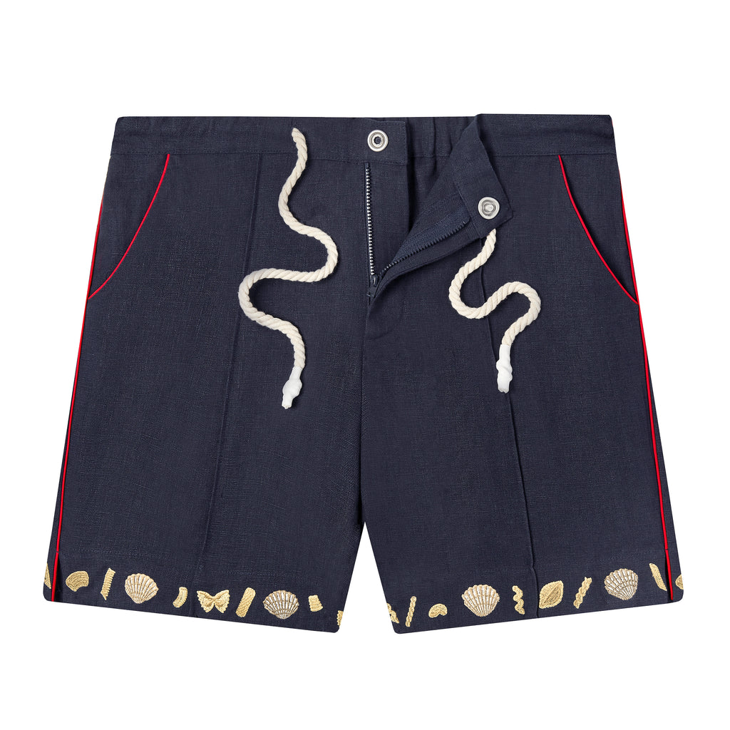 Unbuttoned and unzipped Navy linen Tombolo shorts with clams and pasta on white background