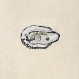 Embroidered oyster close up with button in middle