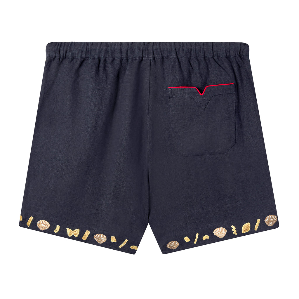 Back view of Tombolo linen shorts with signature V pocket and red piping