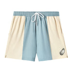 Emboridered oyster swim trunks in light blue and cream on white backdrop