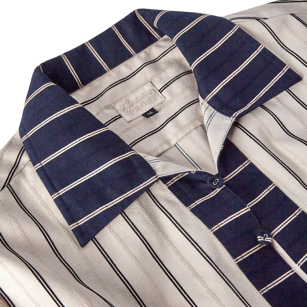 Close up of Tombolo pop-over navy striped collar and Special Tombolo pop-over tag in size medium 