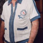 Close-up of older gentleman wearing the 'Explorer's Club' Chum Cabana mostly zipped. His hand is in his pocket. 