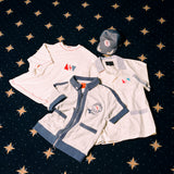 Image of all four 'Explorer's Club' x Tombolo items, featuring a Terry Tee, a Field Uniform, a TerryCloth Cabana and a Souvenir Cap.