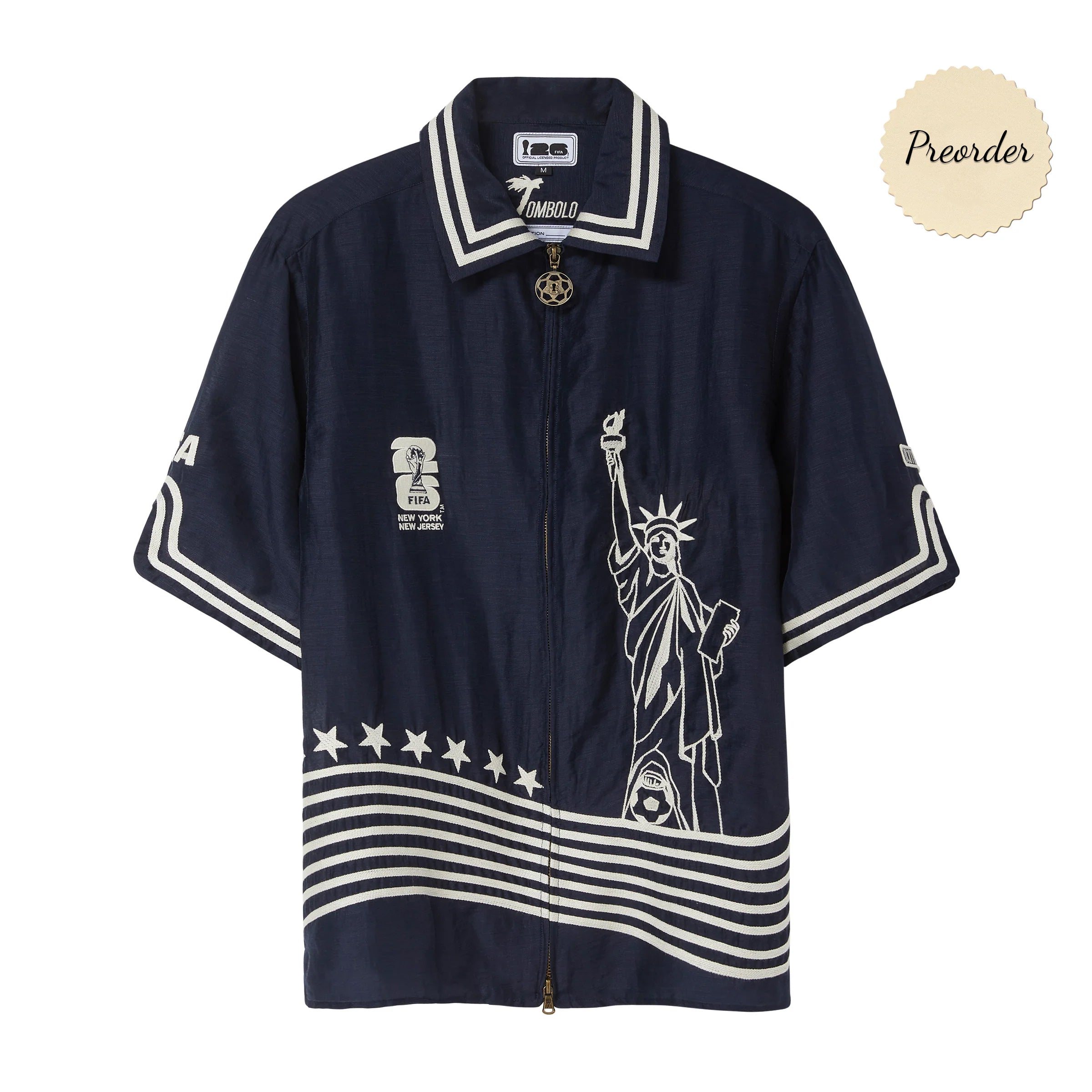 Navy short sleeve zip cabana shirt with white Statue of Liberty embroidery, striped hem and sleeve trim, and FIFA New York New Jersey chest embroidery.