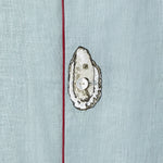 close up of embroidered oyster on top of middle shirt button