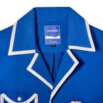 Close up of white contrast piping collar