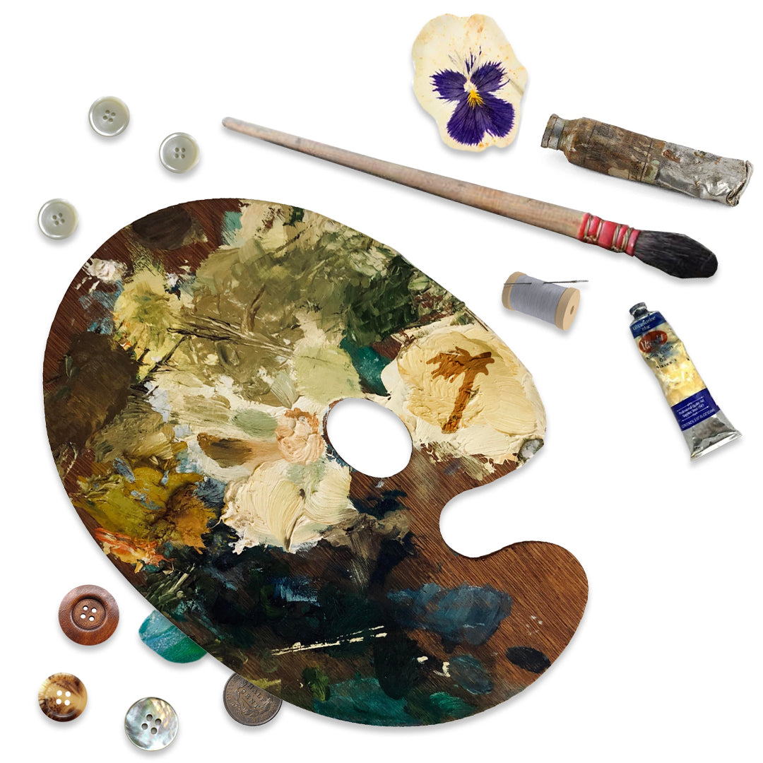 Close up of palette and used paint tubes