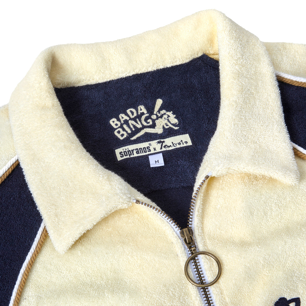 Close-up product image of 'The Sopranos' Bada Bing Cabana's custom 'The Sopranos' x Tombolo label and chain-stitched Bada Bing! logo