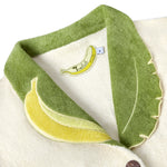 Close-up of the interior label, in the shape of a banana, reading 'Tombolo Crop Cut'.