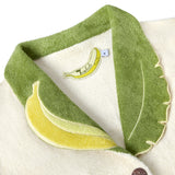 Close-up of the interior label, in the shape of a banana, reading 'Tombolo Crop Cut'.