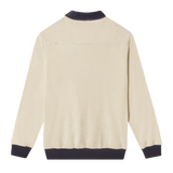 Backside of long-sleeve terry cloth 'Blubber' Cabana, featuring beige terry cloth with dark blue collar and cuffs. 