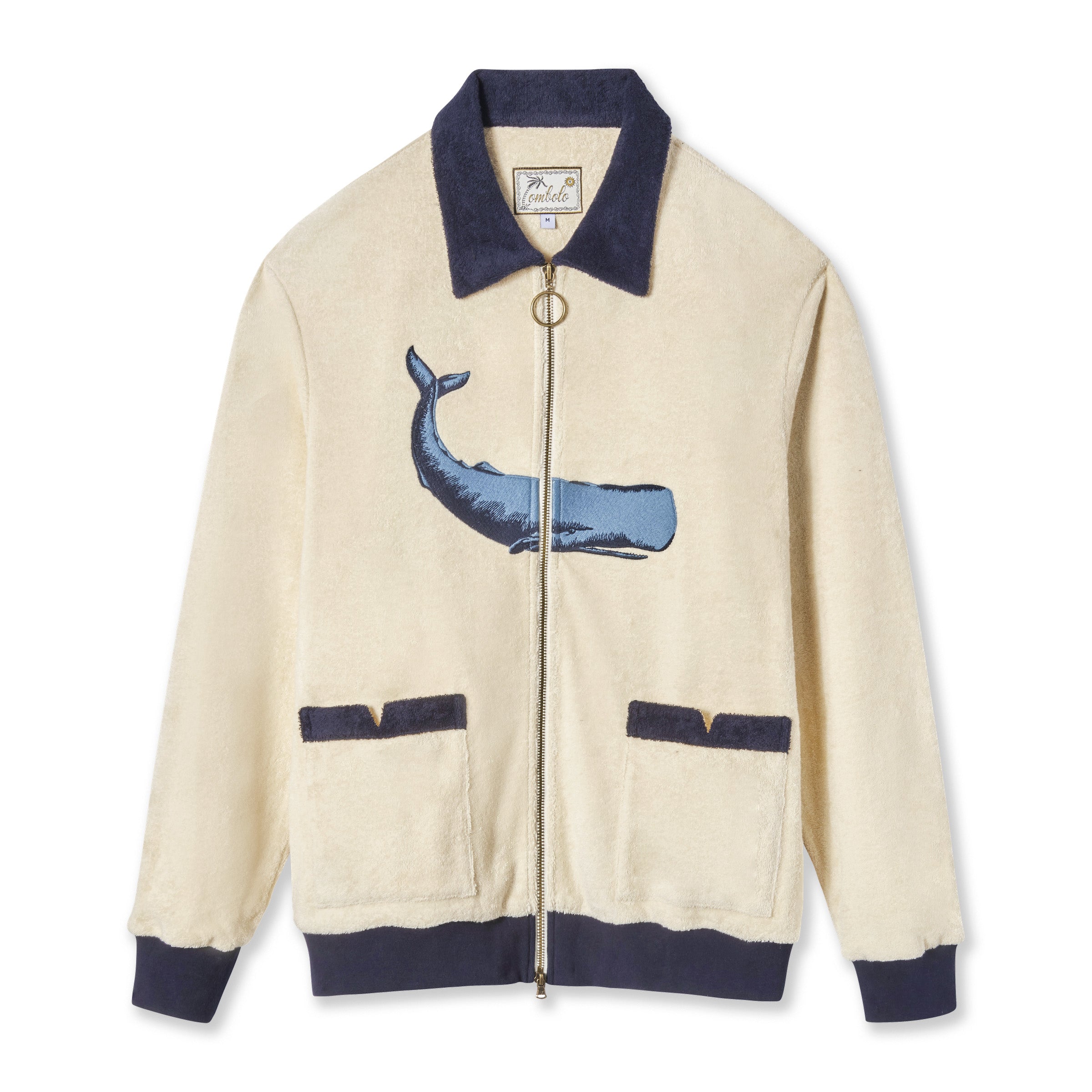 Full-zip long sleeve cabana shirt in beige with a contrast navy collar and cuffs featuring an embroidered whale on the front. 
