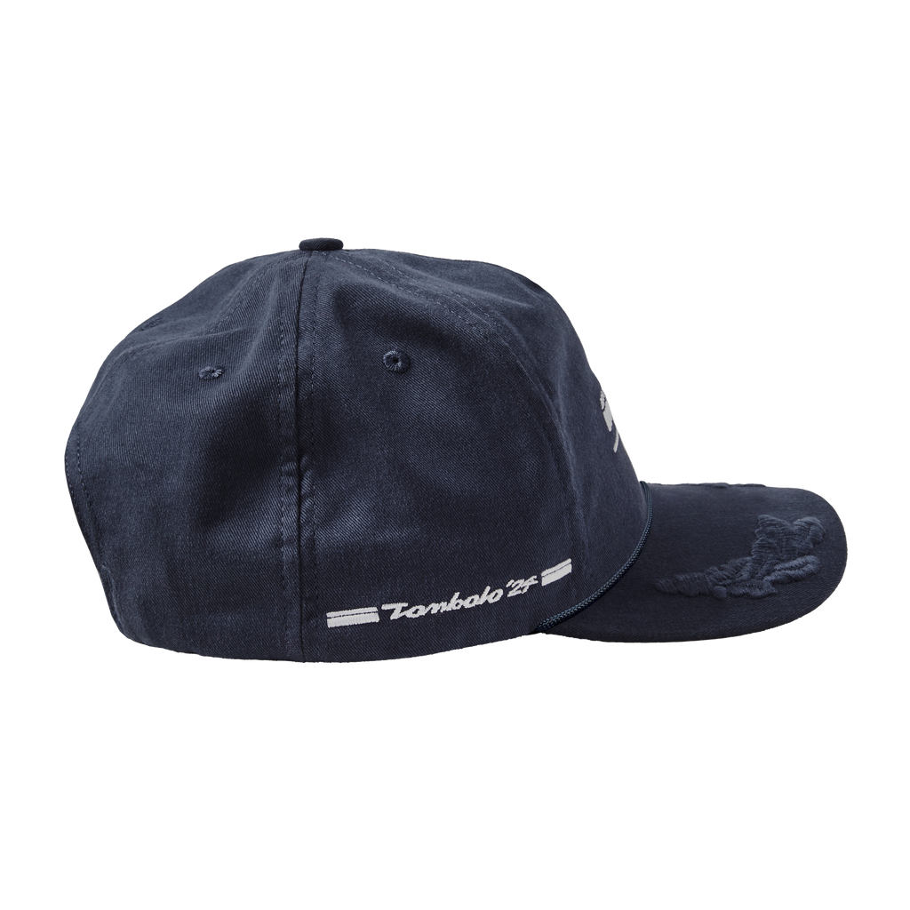 Side view of Boston Whaler Cap, and the right side of hat features  the text “Tombolo '24” flanked by two white stripes.