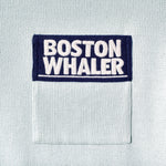 Close-up of color blocked chest pocket with embroidered 'Boston Whaler' logo.