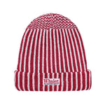 Red and white striped knit beanie with a folded brim. Features a 'Whaler The Unsinkable Legend' patch on the front.