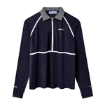 Navy long-sleeve sun shirt with white piping across the chest and down the sleeves. Features a striped collar, quarter zip front, and white embroidered text reading 'Whaler' on the left chest. 'Tombolo' is embroidered on the right sleeve cuff and 'UPF 50+' on the left cuff.