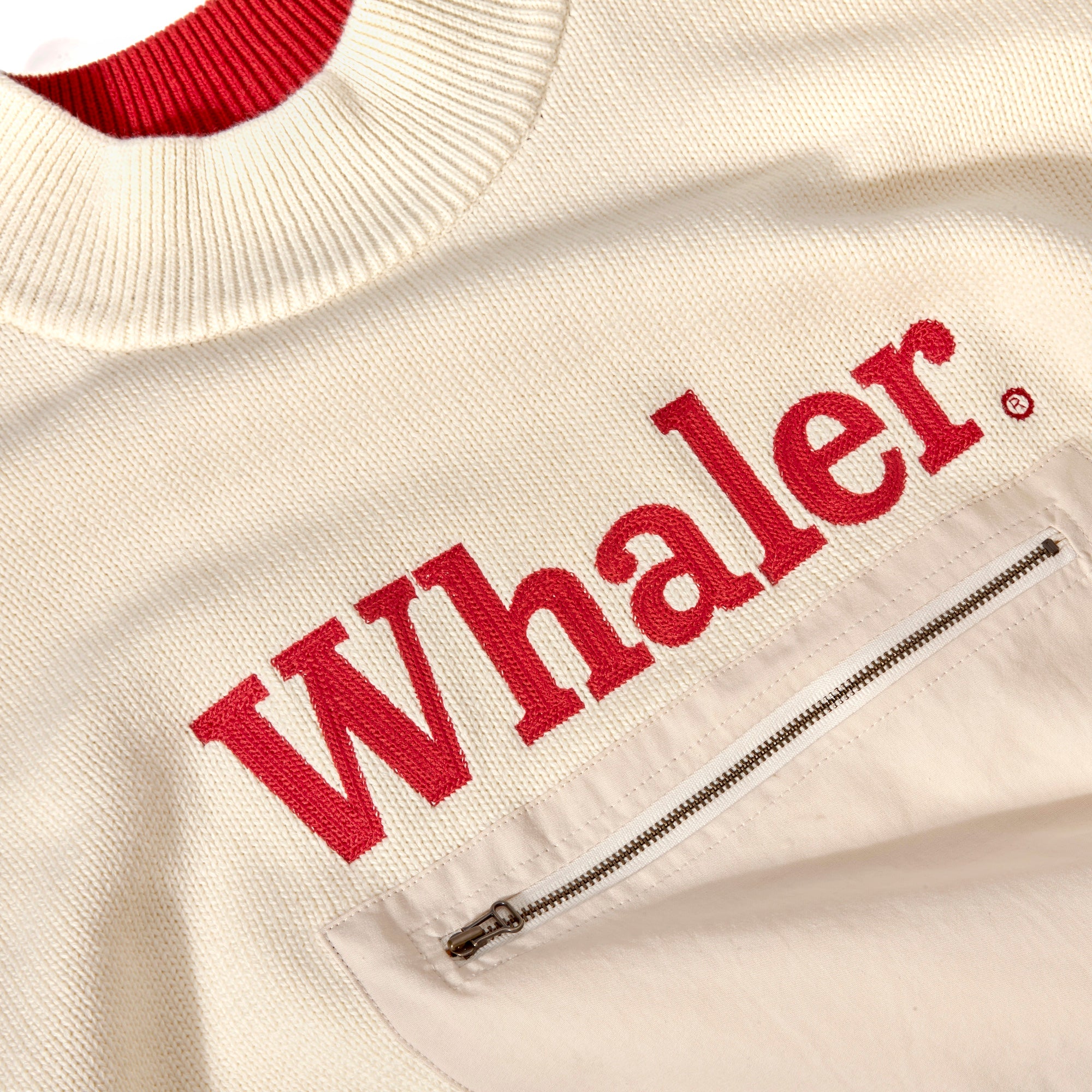 Close-up product image of the 'Boston Whaler' Sweater that showcases the front pocket and Whaler logo text on the front.