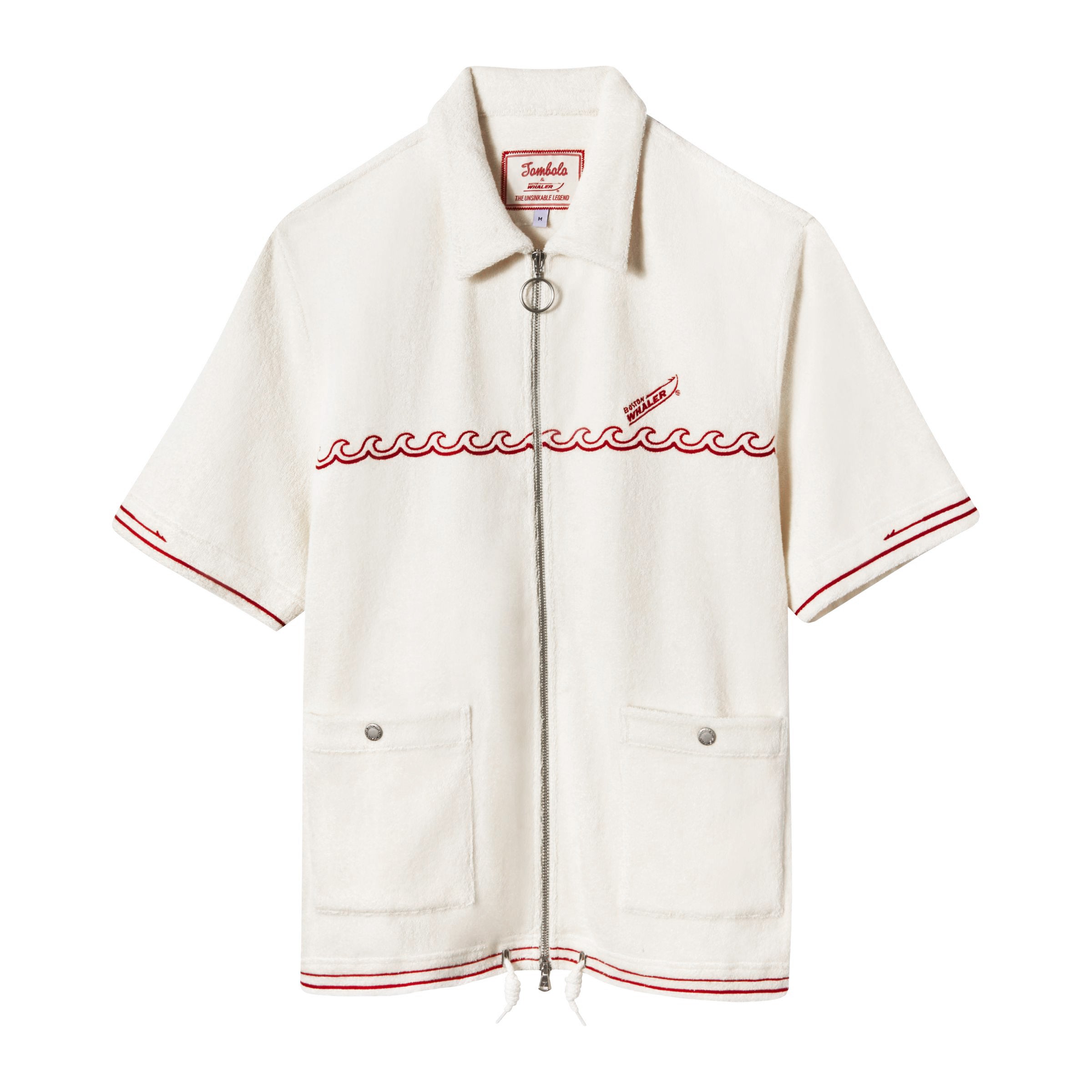 A white short-sleeved 'Boston Whaler' branded shirt with red chainstitched harpoon hull stripe on cuffs and bottom sweep, featuring a two-way nickel zipper with ring pull and front patch pockets with nickel snaps.