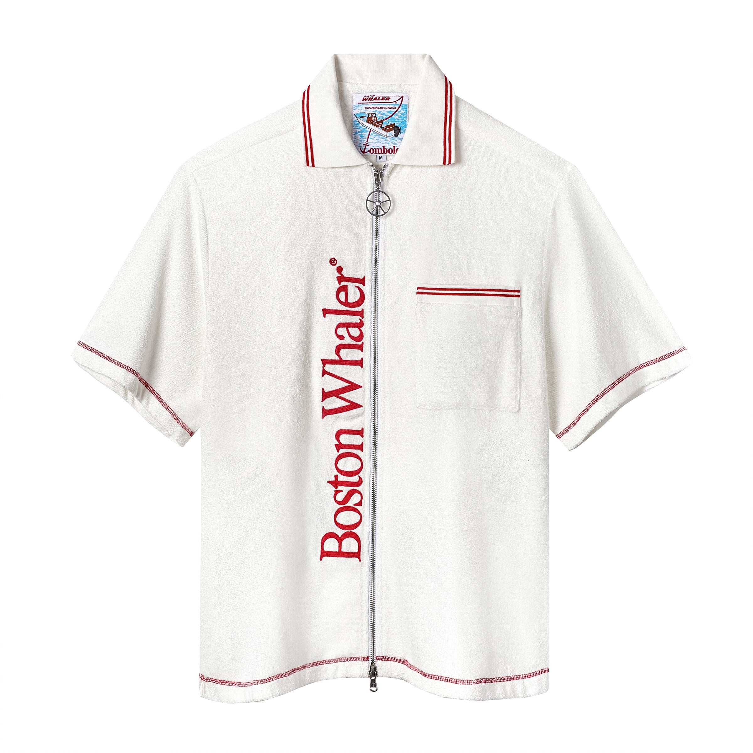 White short-sleeve terry cloth zip-up shirt with red vertical 'Boston Whaler' text, red contrast stitching, a front chest pocket with red stripes, and a ship wheel zipper pull.