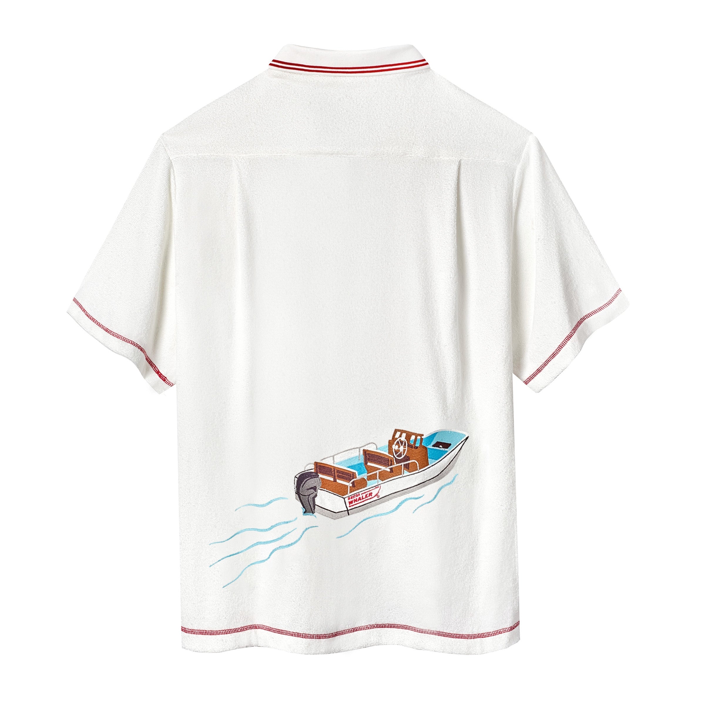Backside of white short-sleeve terry cloth zip-up shirt with  red contrast stitching and a boat illustration across the back.
