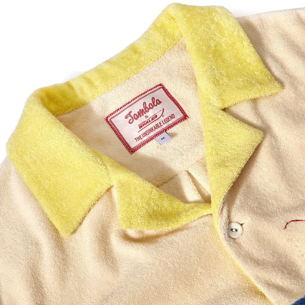 Close-up product image of the 'Boston Whaler' No nibbles cabana interior tag with both Tombolo and Boston Whaler logos, and text that reads: 'the unsinkable legend.'