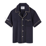 Navy short-sleeved Tencel twill shirt with a relaxed collar, beige piping, and Agoya shell buttons, customizable with embroidery.