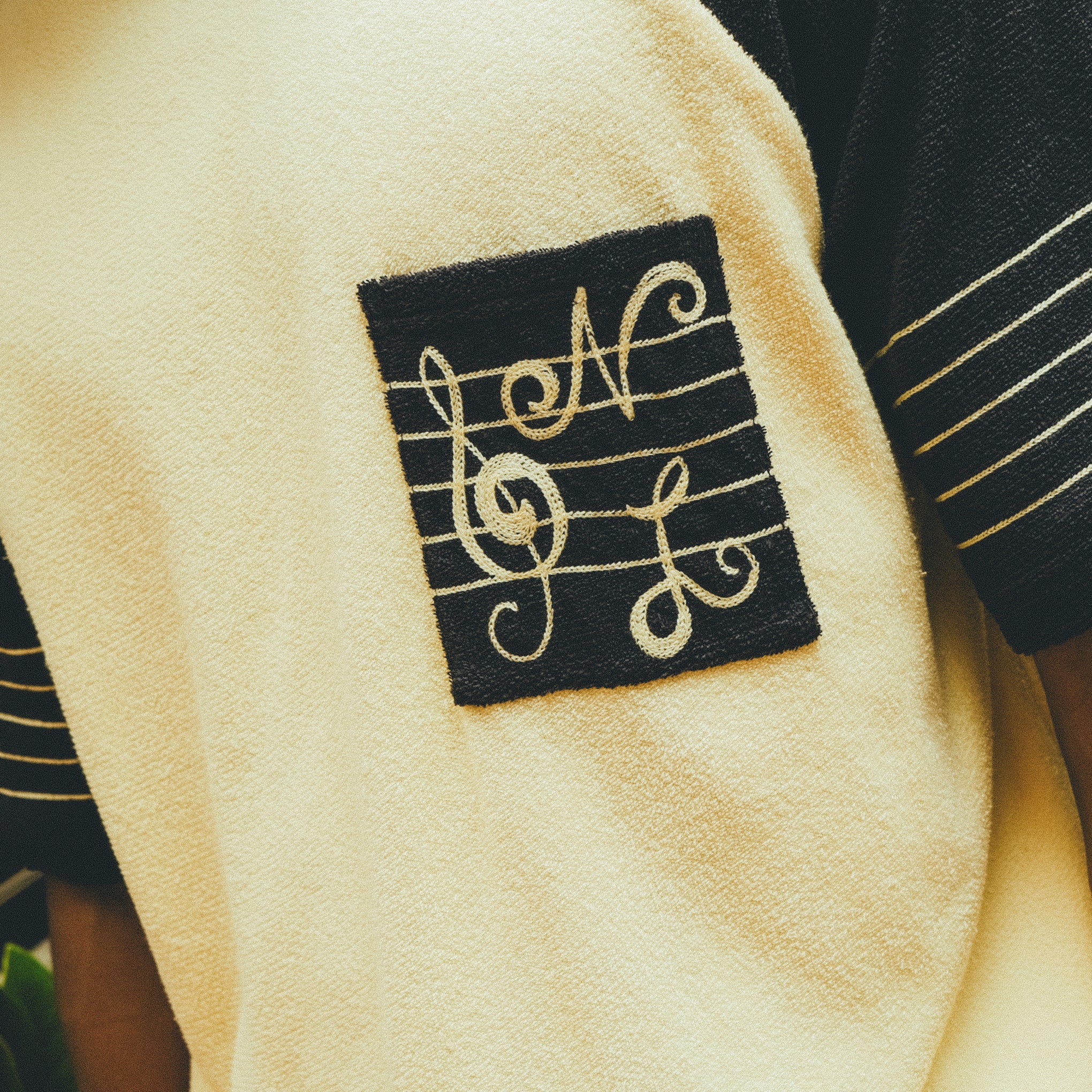 Close-up of SNL embroidery on chest pocket. 